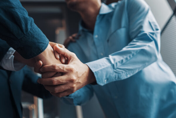 Attorney & client shaking hands. What is my case worth.